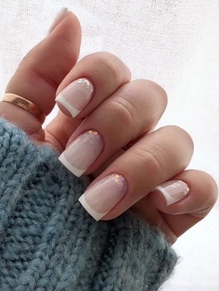 French manicure with holographic glitter accents